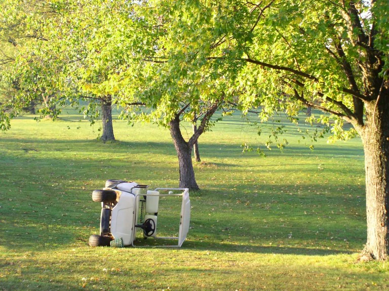 Overturned golf cart